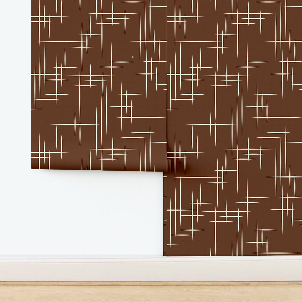 The artwork consists of a red square background with a repeating pattern of starburst shapes created by intersecting elongated lines. These lines are light-colored, contrasting sharply against the red background. The lines form multiple four-pointed stars with varying lengths and thicknesses, radiating outward in a geometric arrangement. The composition presents a clean, mid-century modern aesthetic, emphasizing simplicity and bold contrasts.